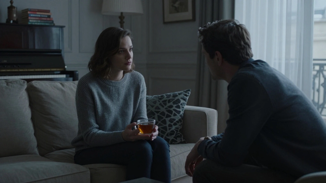 A woman in Paris listens intently to a man in her living room at dusk, no physical contact.